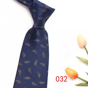 Close-up of the elegant navy blue men's necktie featuring detailed feather jacquard patterns.