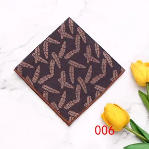 Men's polyester pocket square detail shot with geometric feather pattern on marble background.