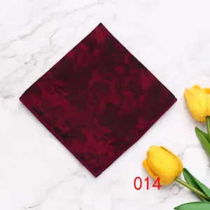 Detail view of men's dark red geometric polyester pocket square, elegant suit accessory.