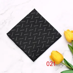 Men's black pocket square detail, geometric dot pattern polyester fabric suit accessory.