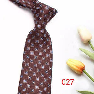 Classic brown patterned men's necktie with elegant geometric design for business suits and formal events.