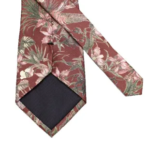 Men's floral necktie in reddish brown with tropical botanical print for business and formal wear.