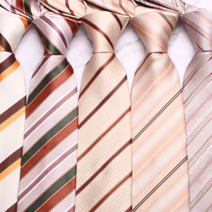 Detail shot of men's business casual striped necktie in elegant champagne and brown colors.