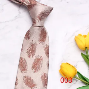 Classic men's feather patterned necktie close-up detail showcasing fine fabric texture and elegant design.
