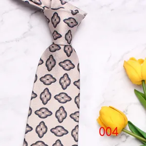 Closeup detail of light patterned mens tie with exquisite geometric print and soft fabric texture.