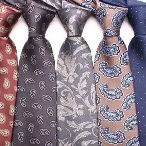 Closeup of assorted classic men's silk ties featuring elegant paisley and polka dot patterns.
