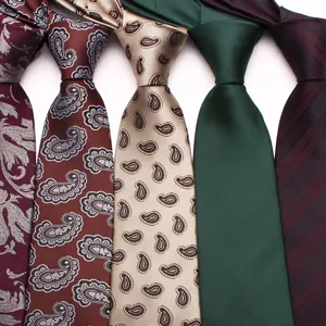 Detailed view of classic men neckties featuring paisley, dot and stripe patterns for business wear.