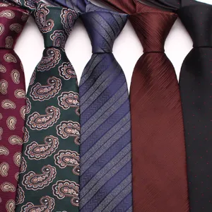 Detailed close-up of men's silk ties featuring classic paisley, striped, and dotted patterns.