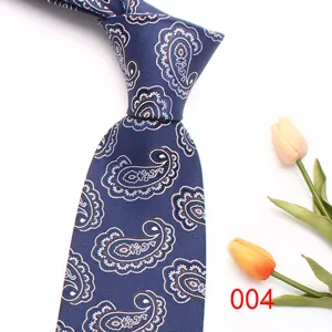 Detail view of the classic navy blue necktie featuring intricate paisley pattern design.
