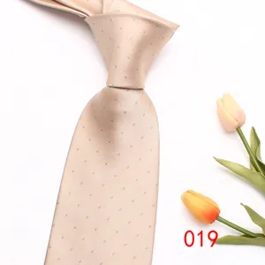 Elegant champagne polka dot men's tie, premium polyester silk material for business and weddings.