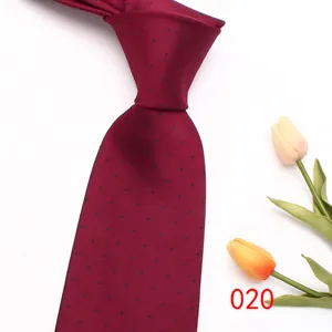 Classic burgundy men's tie with blue polka dot pattern, elegant business silk necktie.
