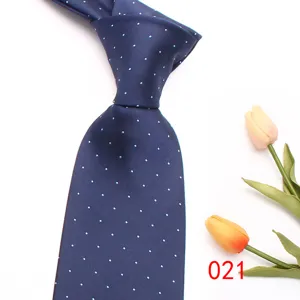 Classic navy blue men's necktie featuring elegant white polka dots for business and casual wear.