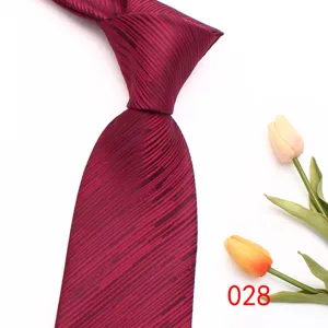 Detailed view of classic burgundy striped men's necktie made from premium polyester silk.