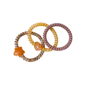 Set of 3 telephone wire hair ties with chic plaid pattern, star charm and elegant design.
