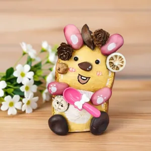 Close-up detail of handmade natural plant seed doll ornament, creative DIY cute animal decor.