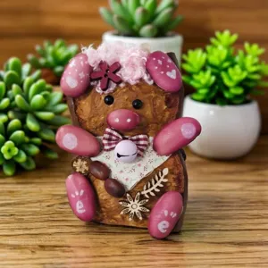 Close-up detail of handmade bean pod doll pendant, showing exquisite craft and cute design details.