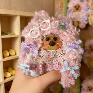 Handmade cute bean pod doll pendant detail showing pink fluffy hood and lovely colorful ribbons.