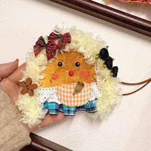 Handmade cute bean pod doll pendant close up detail showcasing fluffy hair and checkered apron