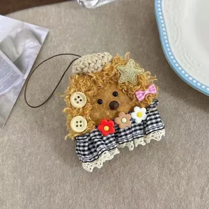 Cute fluffy curly hair bear plush bag charm pendant with checkered skirt and flowers.