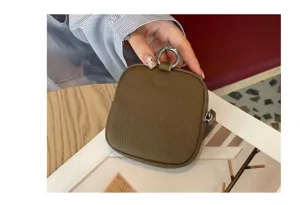 Mini leather coin purse for women, cute zipper wallet with key ring and compact storage.