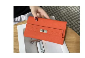 Luxury genuine leather long wallet for women, elegant Kelly style orange clutch purse with turn lock.