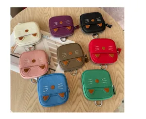 Detailed view of cute cat design leather coin purses with zipper closure and keyring attachment.