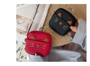 Detailed view of cute cat leather coin purse, mini zipper wallet with keychain for women.