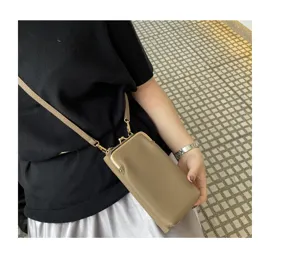 Genuine leather mini mobile phone bag, stylish crossbody kiss-lock small handbag for women.