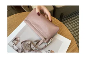 Genuine leather long clutch bag for women, portable zipper wallet with wrist strap daily use.