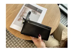 Genuine leather women long clutch bag portable wristlet wallet with zipper phone pocket.