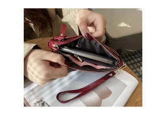 Genuine leather women clutch bag interior detail showing multiple compartments and phone slot capacity.