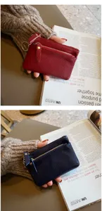 Leather coin purse detail shot, mini zipper wallet with key ring in red and navy blue.