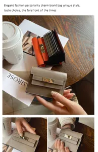 Genuine leather accordion card holder with classic turn-lock strap design, multi-slot wallet.