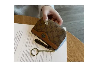Women cute mini coin purse brown monogram zipper wallet with keychain and floral decor.