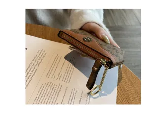 Mini coin purse for women, cute short wallet with zipper and keychain, trendy daily accessory.