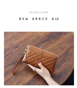 Close-up detail of genuine leather quilted long wallet clutch with elegant metal bee accent.