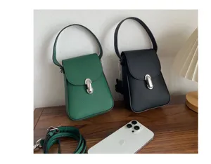 Genuine leather mini crossbody bag for women, stylish phone bag with top handle and strap.