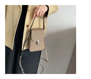 Genuine leather mini crossbody phone bag for women, simple elegant design with metal lock.