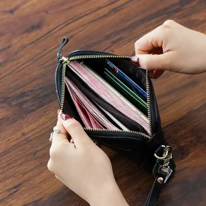 Genuine leather women clutch long wallet, multi card slots cash pocket shell shape design.