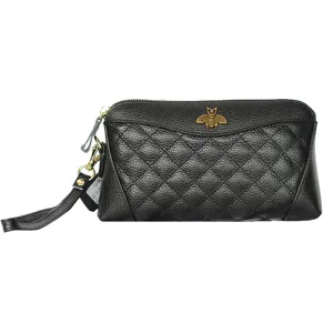 Black genuine leather quilted clutch bag with metal bee emblem and wrist strap for women.