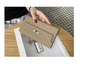 Genuine leather long wallet for women, elegant clutch with turn-lock metal clasp and slots.