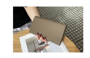Genuine leather long wallet for women, elegant clutch bag and multi-functional phone purse.