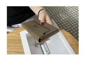 Elegant genuine leather women long wallet clutch bag with metal clasp closure, stylish daily use.