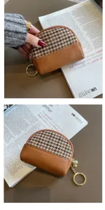 Houndstooth patchwork coin purse with PU leather trim, zipper closure and key ring detail.
