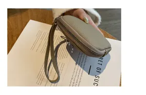 Echtes Leder Mini-Geldbeutel und Schlüsseletui mit praktischer Handschlaufe für Damen.