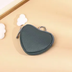 Dark grey heart-shaped leather coin purse detail, featuring a secure zipper and metal ring attachment.