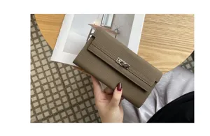 Genuine leather long wallet for women, elegant pebbled cowhide clutch bag with metal lock.