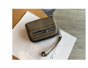 Genuine leather mini coin purse for women, double zipper clutch hand bag detailed view.