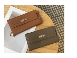 Detailed view of genuine leather long wallet clutch with metal turn lock closure design.