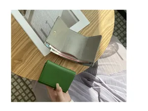 Japanese minimalist genuine leather trifold mini wallet with card slots and coin pocket.